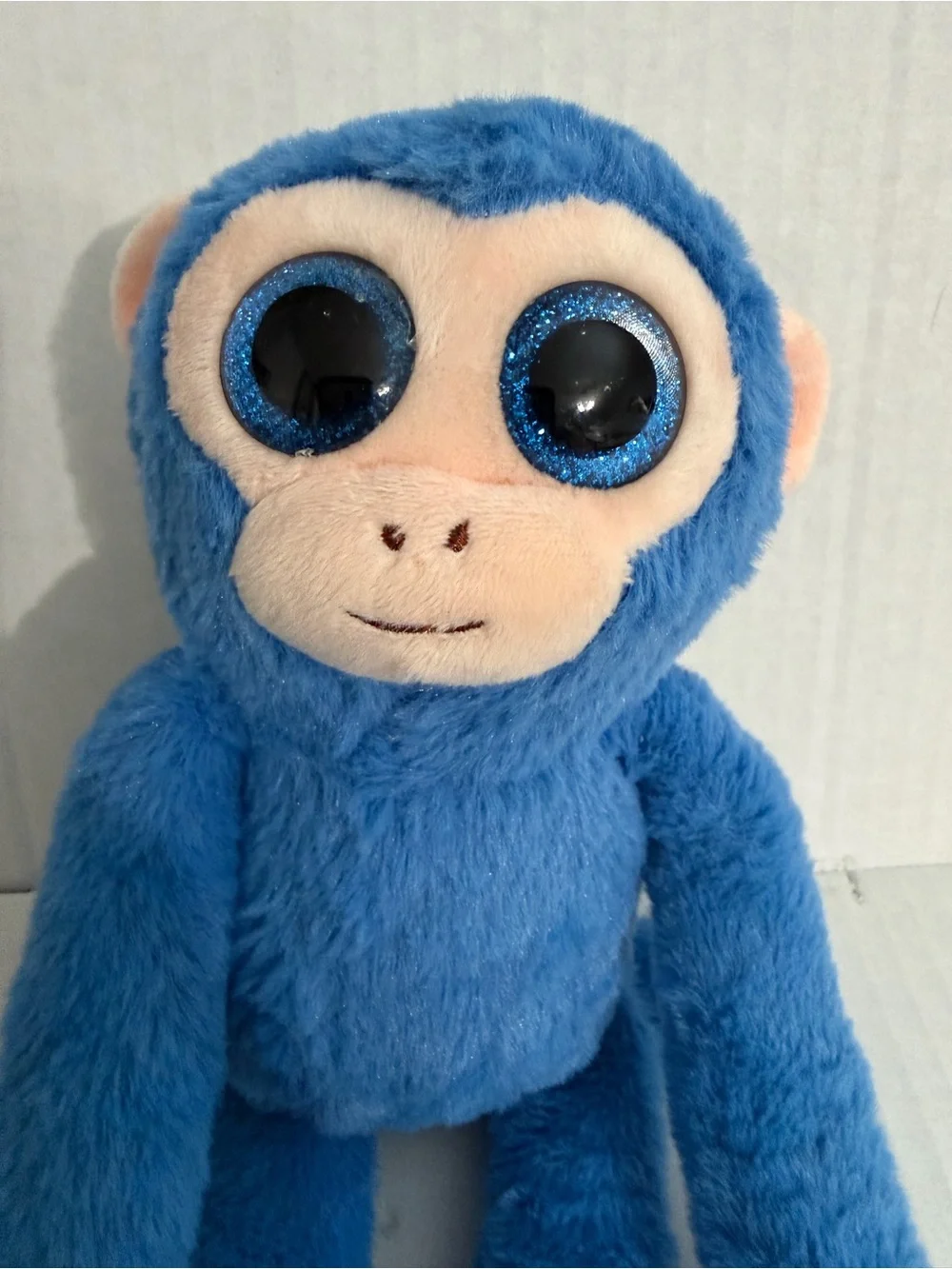 US Fun Machines Glitter Eyes Blue Spider Monkey Plush